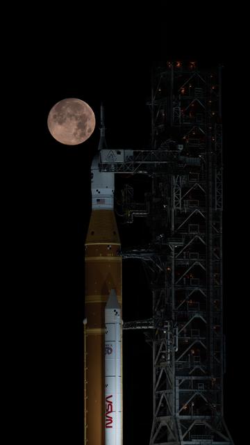 NASA image: Full Moon Rising Over Full Artemis II Stack at Launch Pad 39B